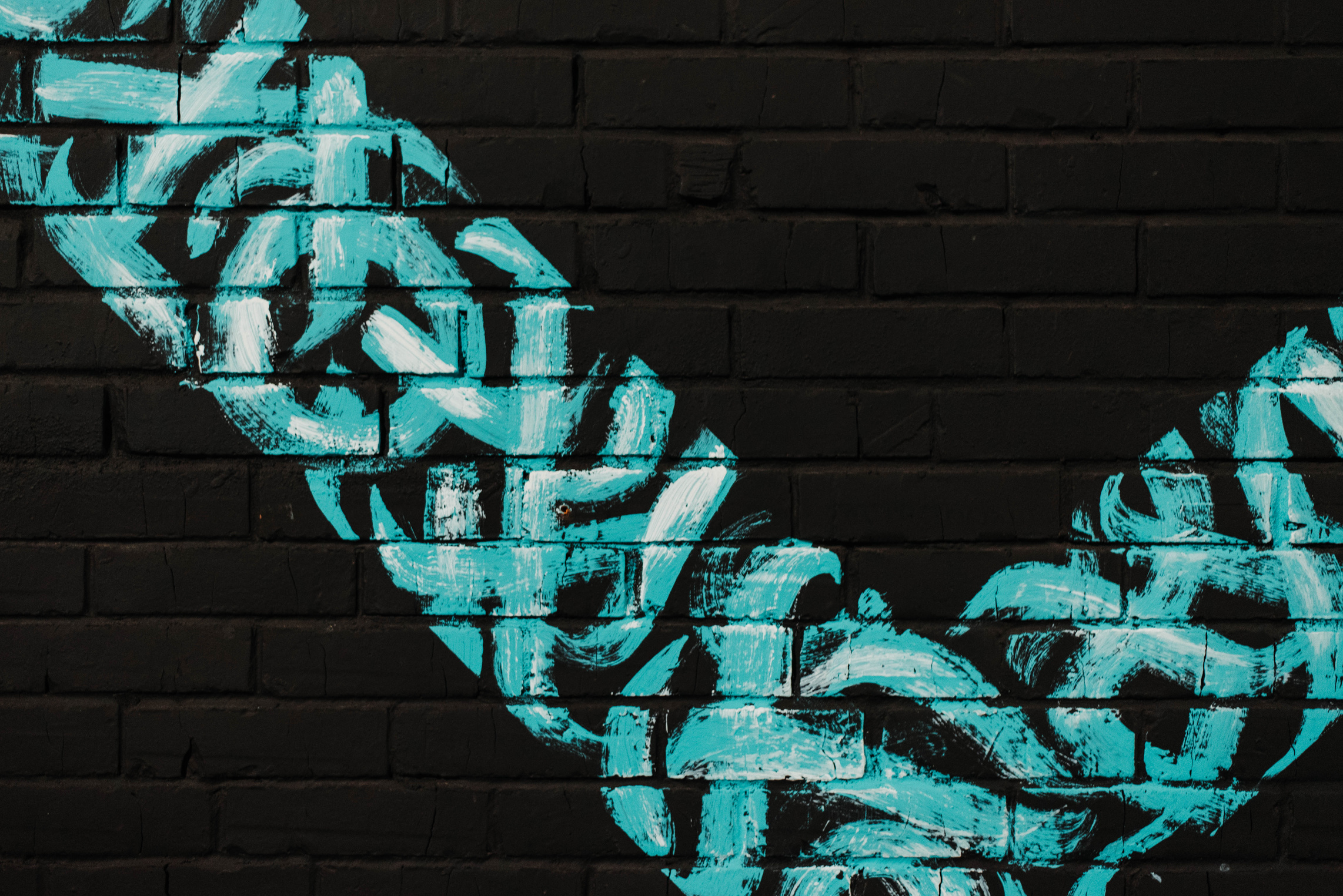 Photo of Graffiti on Brick Wall